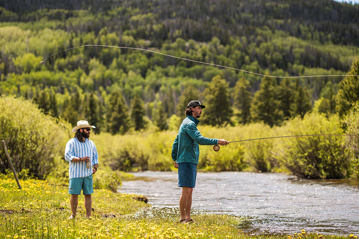 Anglers casting line at one of the best fly fishing rivers in Colorado at Rawah Ranch