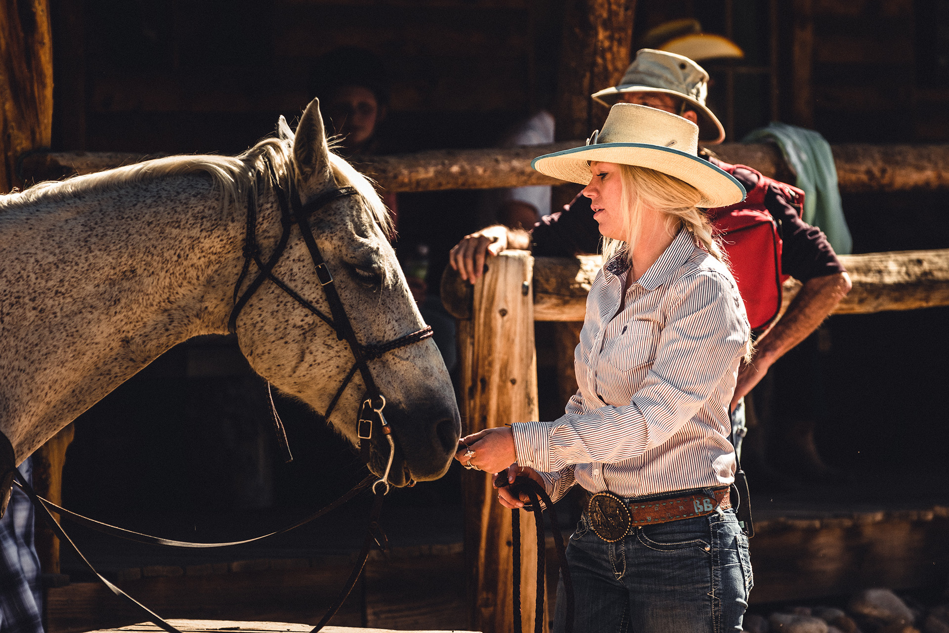 Wrangler with horse during an all-inclusive Colorado vacation at Rawah Ranch